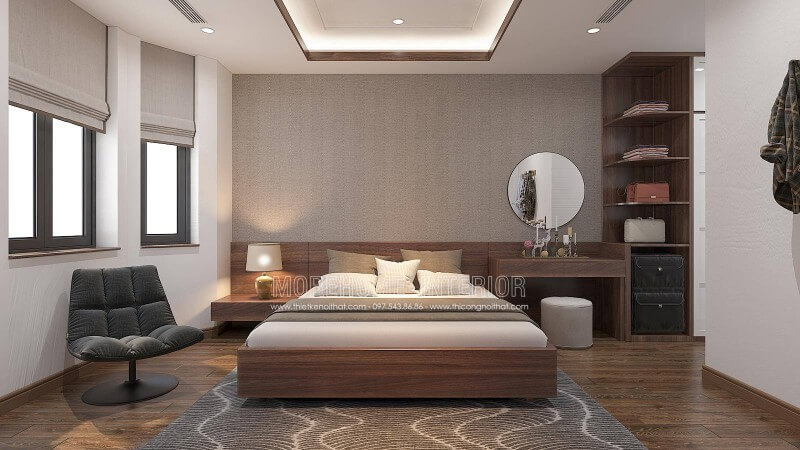Nếu bạn là người ưa thích sự nhẹ nhàng trầm lắng thì thiết kế nội thất phòng ngủ sử dụng gam màu gỗ nâu lại là sự lựa chọn khá hoàn hảo. Cách bố trí nội thất khá tinh tế dành cho nhà phố, biệt thự được kết hợp hài hòa giữa sự tinh gọn vuông vắn cùng đường cong nhẹ nhàng trong chiếc gương tròn trang điểm, chiếc đèn ngủ chụp cong và khối trụ ghế. Thiết kế nội thất nhà phố