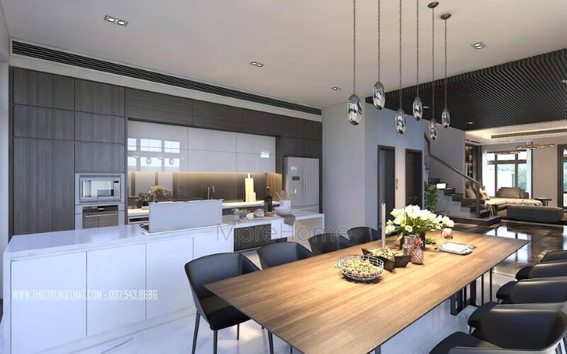 Bàn ăn gỗ nguyên tấm mộc mạc kết hợp đồ nội thất hiện đại sẽ là lựa chọn ấn tượng tạo nên không gian độc đáo cho phòng ăn liền bếp. Thiết kế nội thất nhà phố